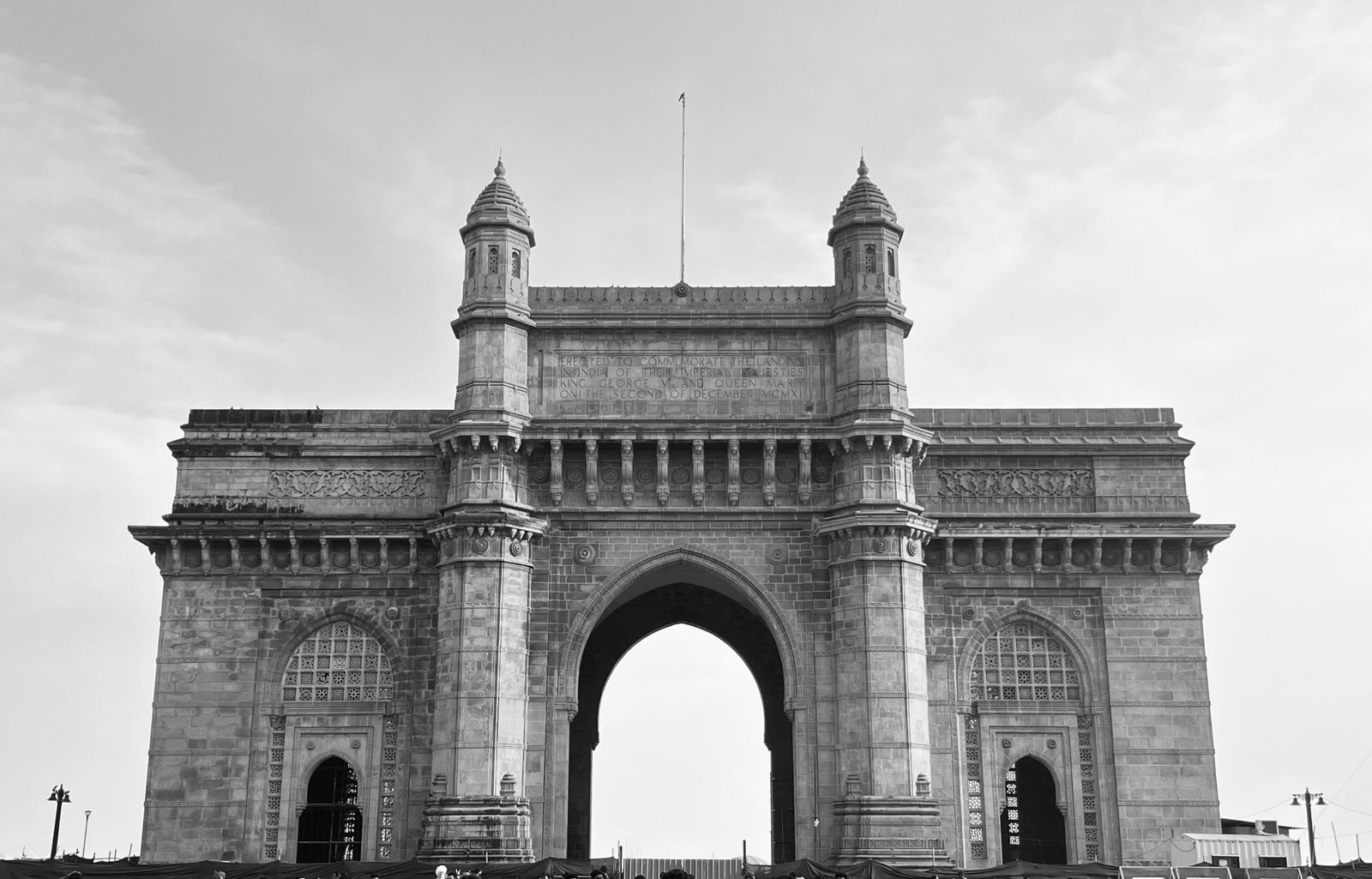 Iconic Gateway of India captured in striking black and white, showcasing architectural elegance.